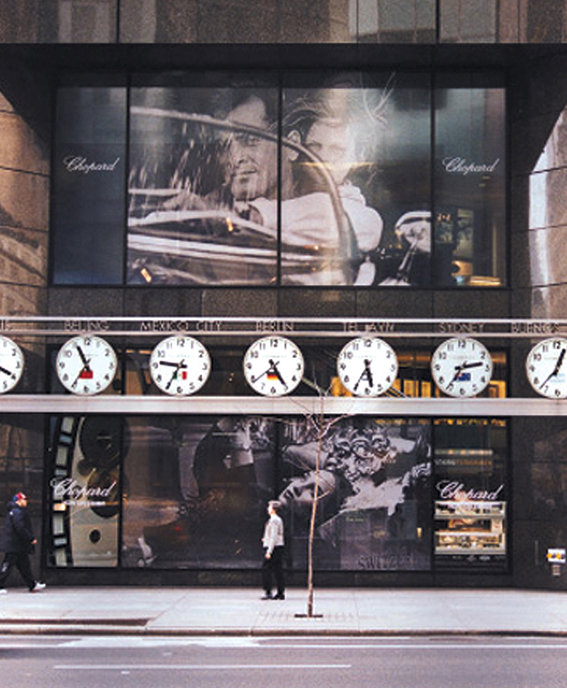 Perforated vinyl window graphics at Tourneau's flagship, the TimeMachine, 5th Ave and 57th Street